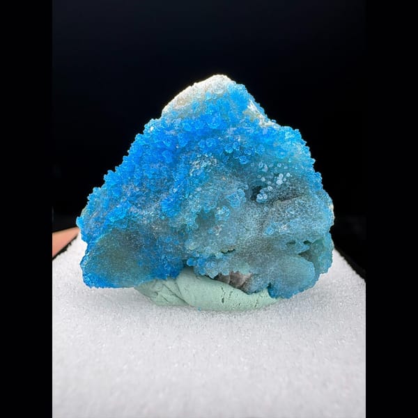 Sparkling cyan allophane crust from Qinglong — complete view