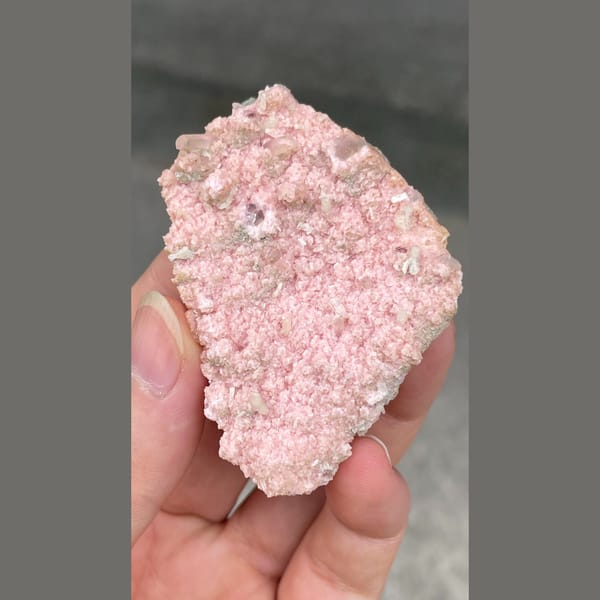 Flat plate of frosty pink rhodochrosite from Bulgaria — detail view