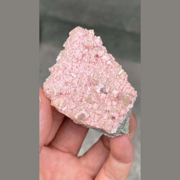 Flat plate of frosty pink rhodochrosite from Bulgaria — detail view