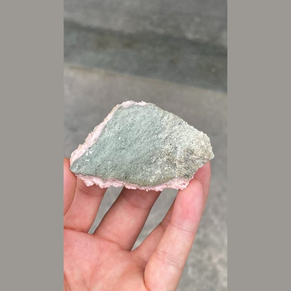 Flat plate of frosty pink rhodochrosite from Bulgaria — detail view