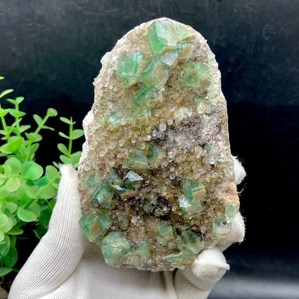Green fluorite cubes on a sparkling quartz plate from Hebei — detail view