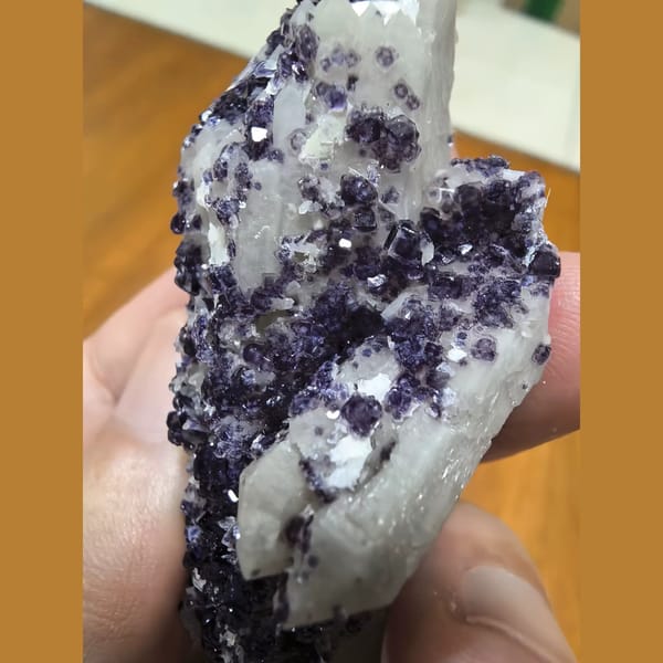 Quartz covered with bright purple fluorite — detail view