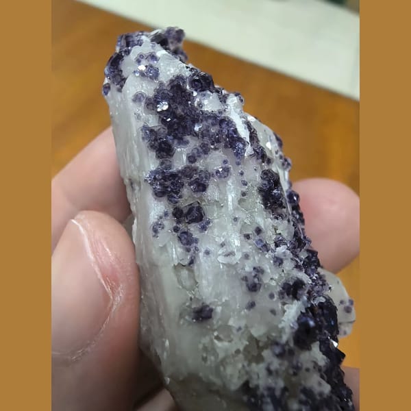 Quartz covered with bright purple fluorite — detail view