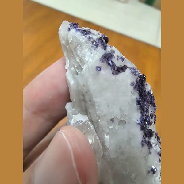 Quartz covered with bright purple fluorite — detail view