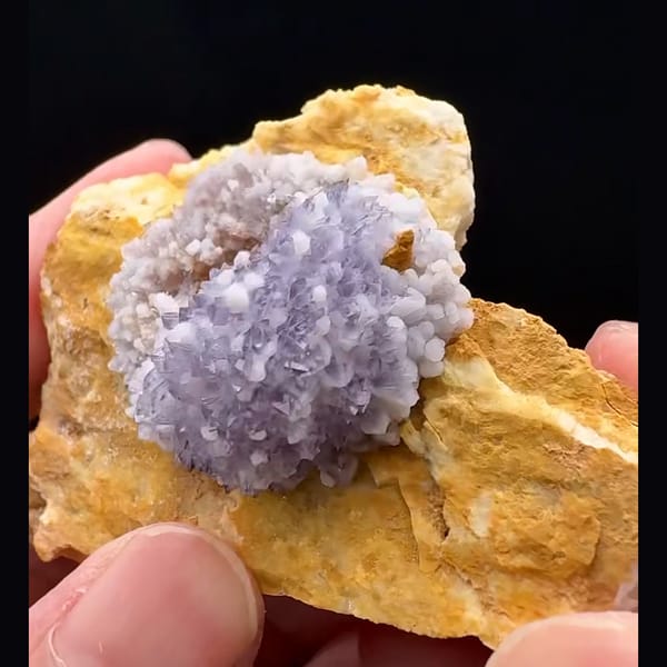 Lavender-purple creedite half-ball on golden-brown matrix from Guizhou — complete view