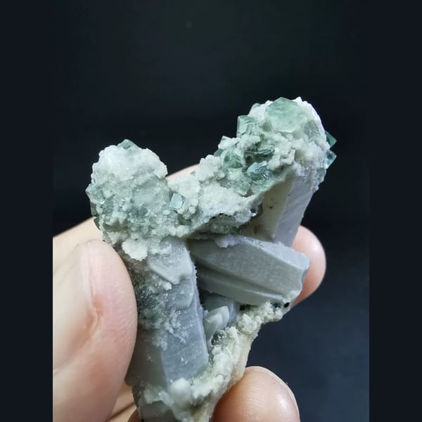 Clear blue fluorite on grey quartz — detail view