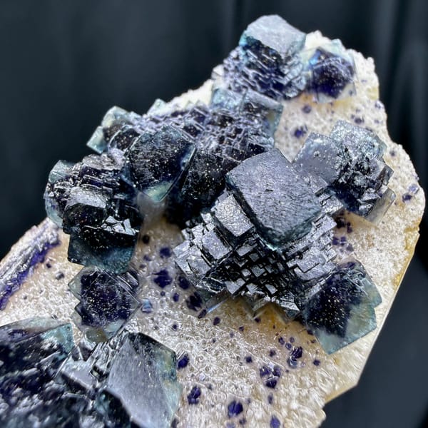 Dark blue-green stepped cubic fluorite on white quartz from Inner Mongolia — complete view
