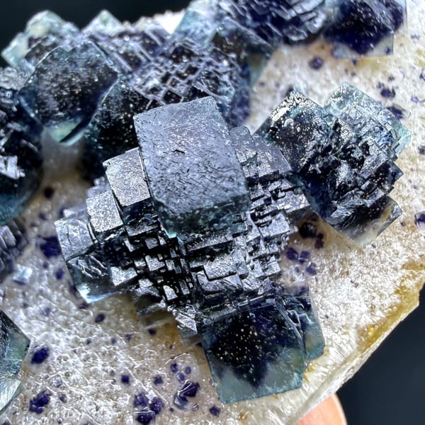 Dark blue-green stepped cubic fluorite on white quartz from Inner Mongolia — alternate view