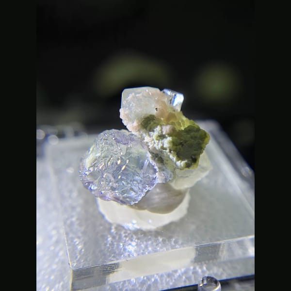 Etched blue fluorite with quartz and rhodochrosite from Piaotang — detail view