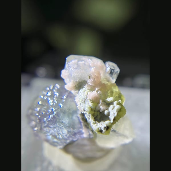 Etched blue fluorite with quartz and rhodochrosite from Piaotang — detail view