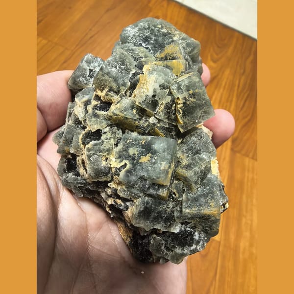 Large green cubic fluorite on candle quartz — complete view