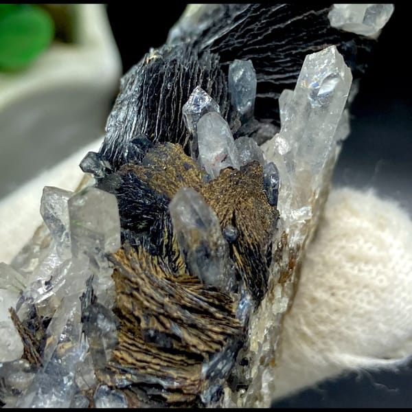 Clear quartz points with black bladed specular hematite from Guangdong — alternate view