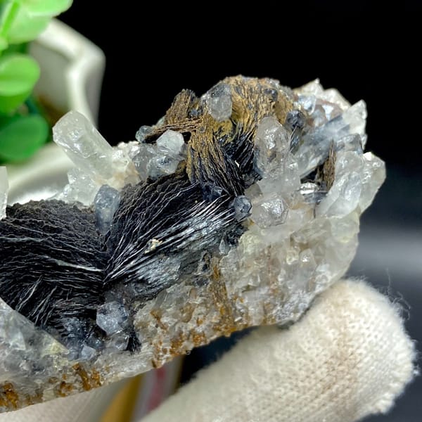 Clear quartz points with black bladed specular hematite from Guangdong — detail view