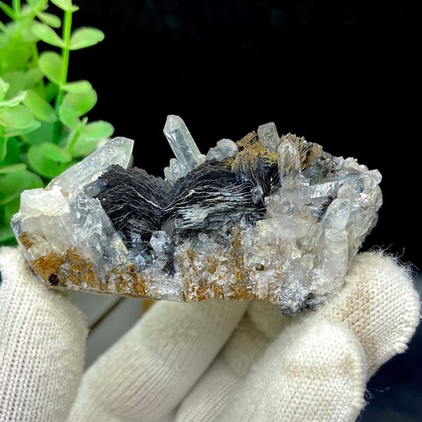 Clear quartz points with black bladed specular hematite from Guangdong — detail view