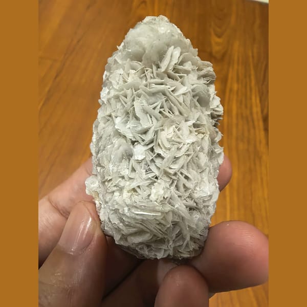 Quartz covered in white bladed calcite — complete view