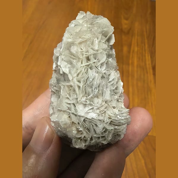 Quartz covered in white bladed calcite — alternate view