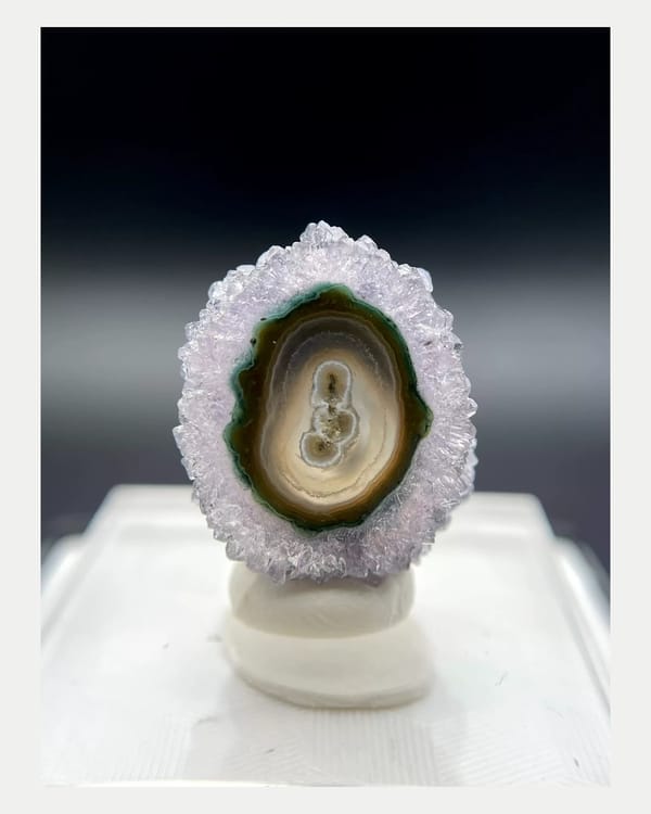 Complete first polished face of miniature Uruguayan quartz slice
