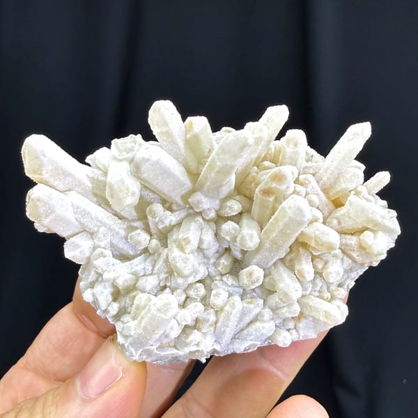 Dense cluster of frosted white quartz crystals from Guangdong — detail view