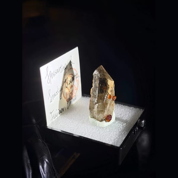 Spessartine garnet on smoky quartz from Fujian — alternate view