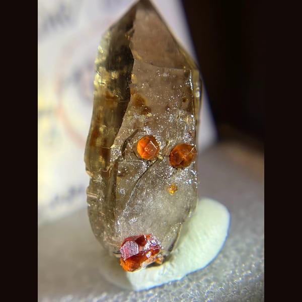 Spessartine garnet on smoky quartz from Fujian — alternate view
