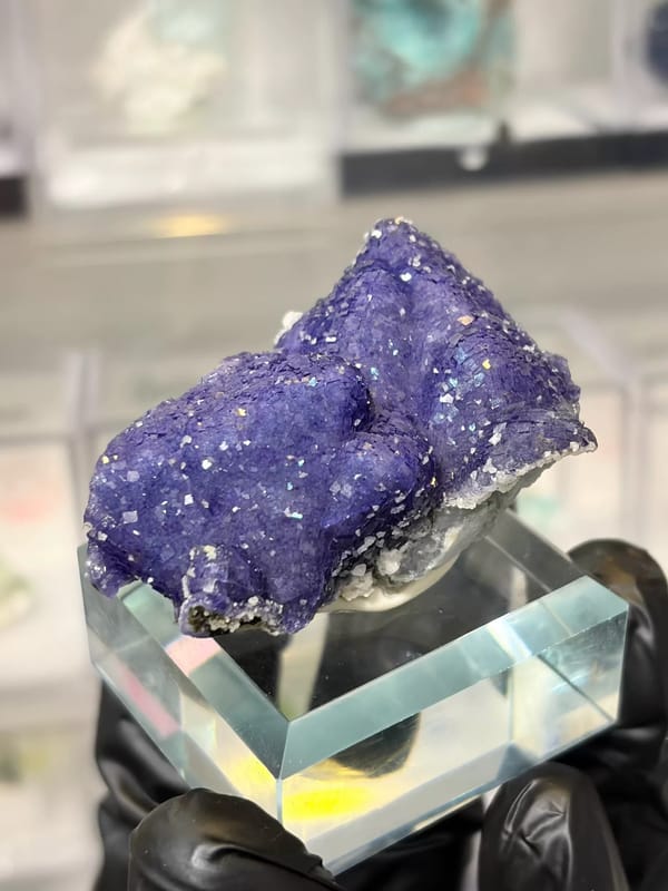 Complete front-right view of purple-blue fluorite and its pale underside