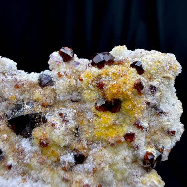 Hyalite opal beads with red garnet on matrix from Fujian — alternate view