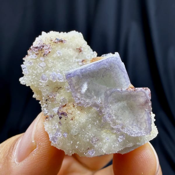 Pale lilac cubic fluorite on white creedite and quartz from Guizhou — complete view