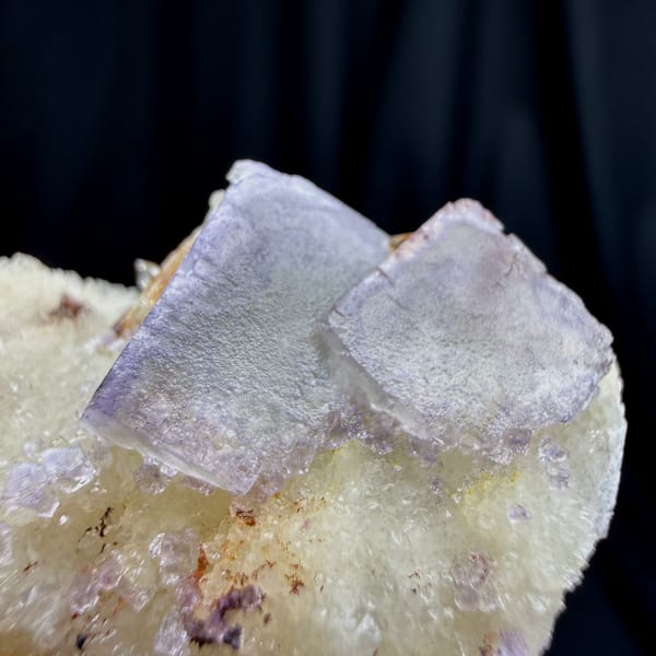 Pale lilac cubic fluorite on white creedite and quartz from Guizhou — alternate view