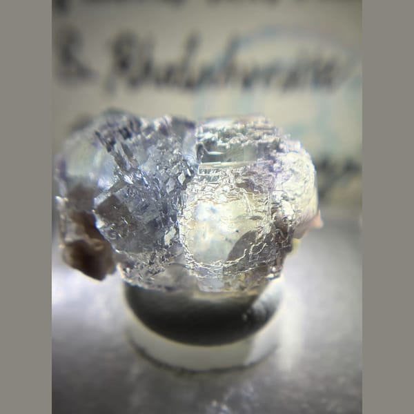 Etched blue fluorite with rhodochrosite from Piaotang — detail view