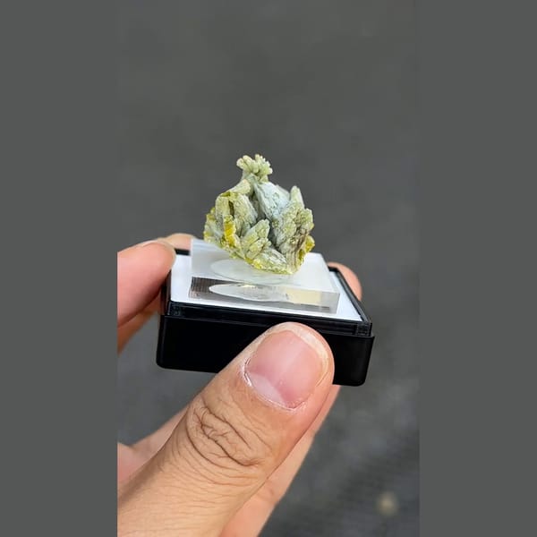 Pale green plumbogummite from Guilin Guangxi, complete front-threequarter view from source video frame 165