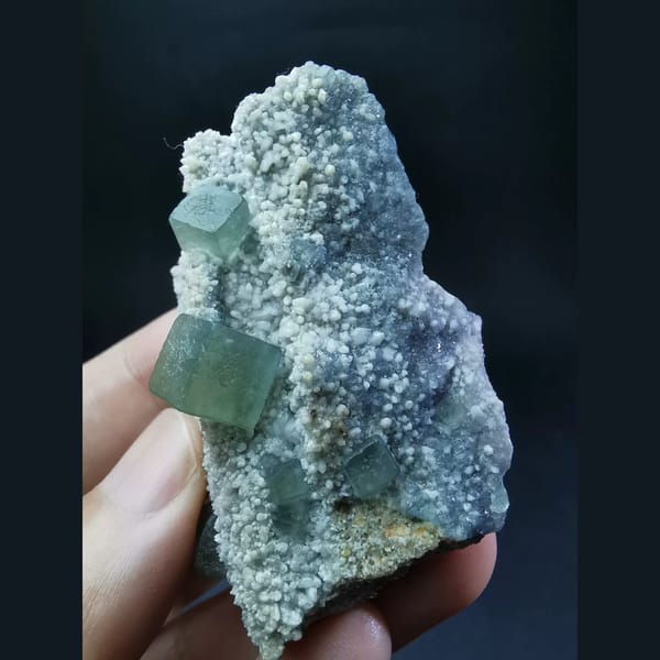 Muted green fluorite cubes on druzy matrix from Inner Mongolia — complete view