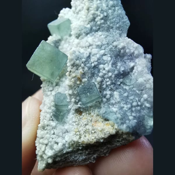 Muted green fluorite cubes on druzy matrix from Inner Mongolia — detail view