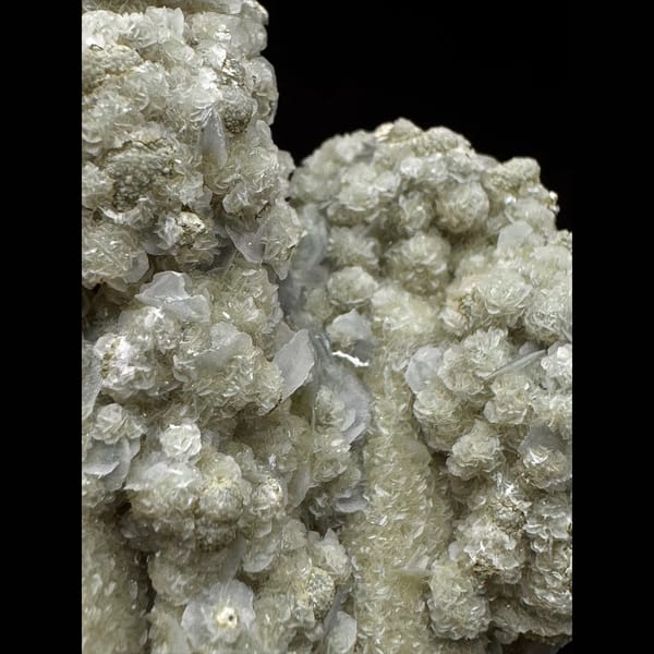 Quartz group covered in white petal calcite and yellow-green calcite from Inner Mongolia — detail view