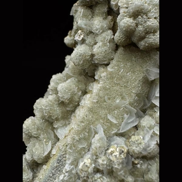 Quartz group covered in white petal calcite and yellow-green calcite from Inner Mongolia — detail view
