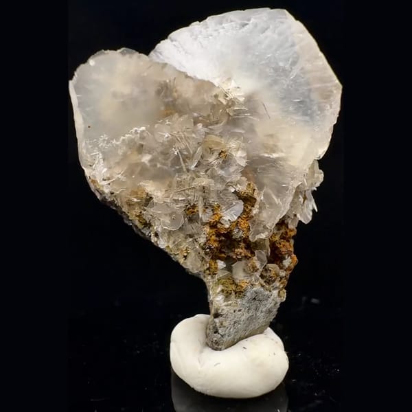 Translucent fan-shaped calcite blades on brown crystals from Fujian — alternate view