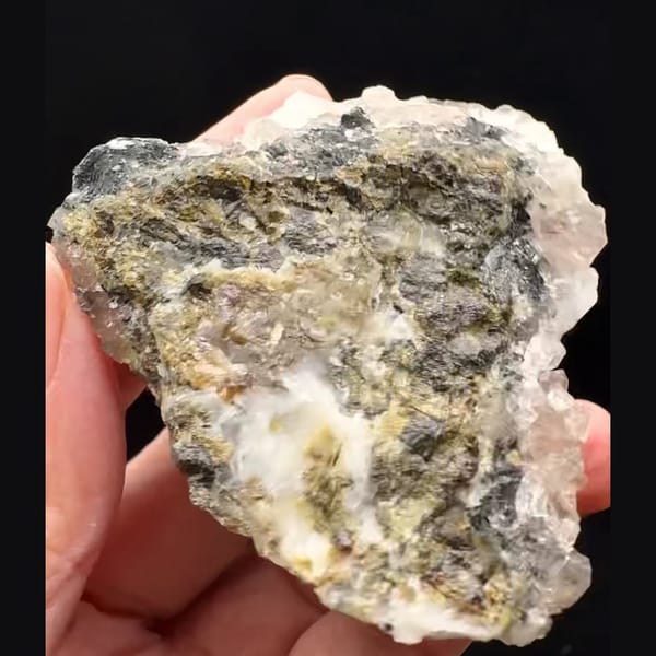 White petal calcite on smoky quartz with specular hematite from Inner Mongolia — detail view