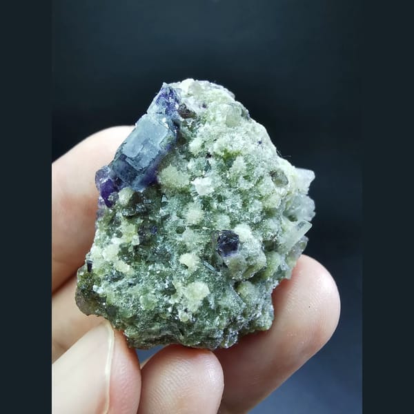 Purple fluorite with mica and quartz from Yindu — alternate view