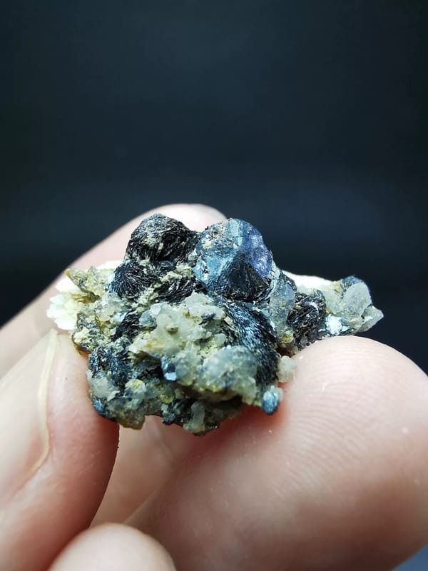 Whole fan calcite specimen showing the hematite-bearing underside