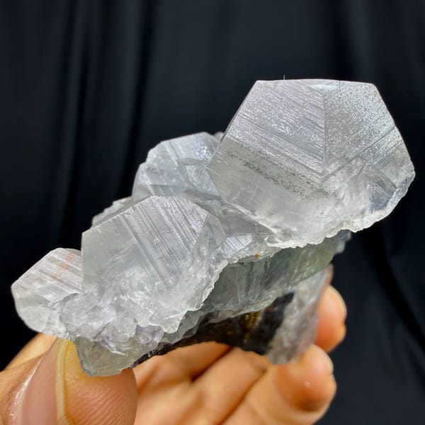 Star-twinned calcite with purple-cored green fluorite and pyrite from Fujian — alternate view