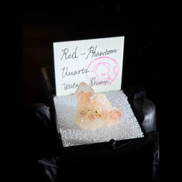 Red phantom quartz cluster from Wutai, Shanxi — complete view