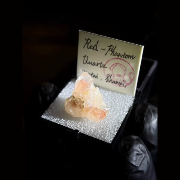 Red phantom quartz cluster from Wutai, Shanxi — alternate view