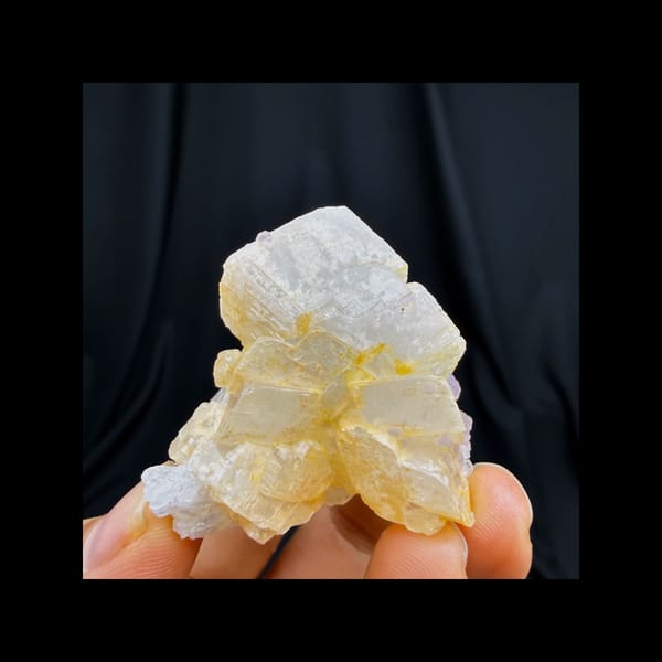Complete front view of purple rounded fluorite with dolomite and quartz