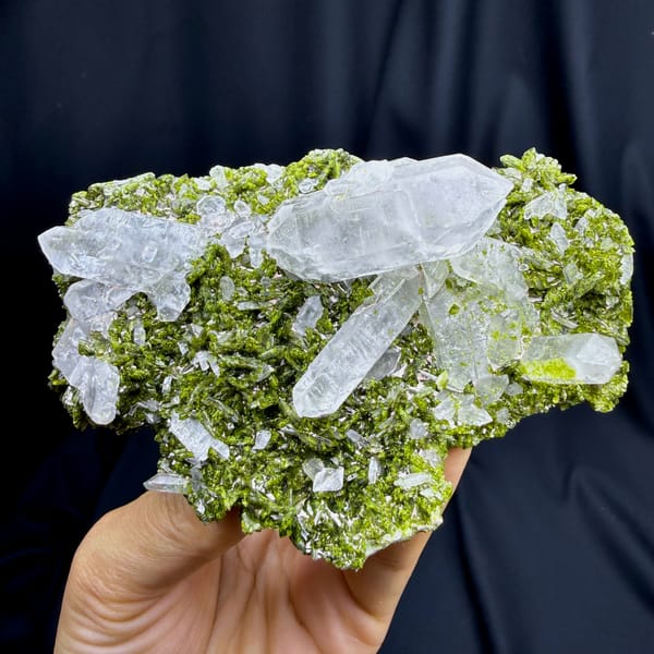 Clear double-terminated quartz on green epidote from Sichuan — complete view