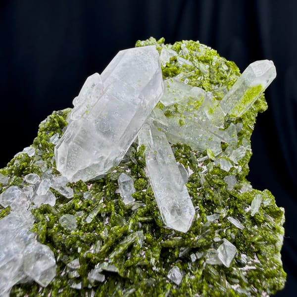 Clear double-terminated quartz on green epidote from Sichuan — alternate view
