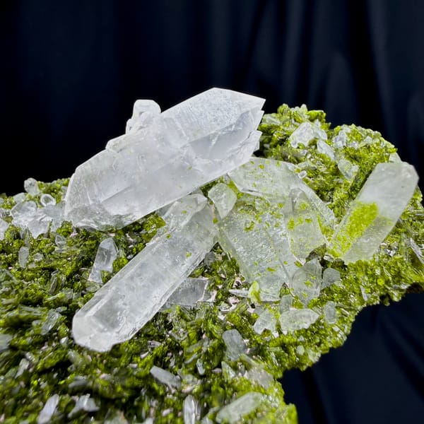 Clear double-terminated quartz on green epidote from Sichuan — alternate view