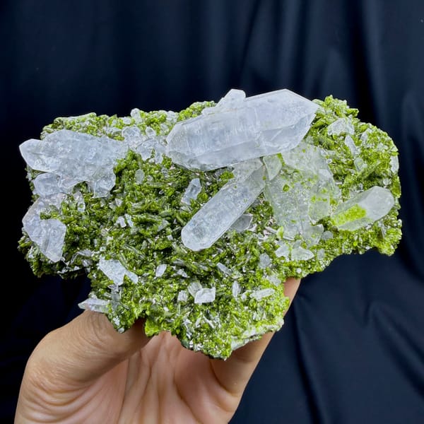 Clear double-terminated quartz on green epidote from Sichuan — detail view