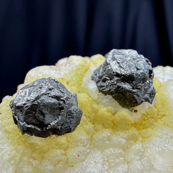 Dark spherical pyrite balls on yellow quartz from Jiangxi — alternate view