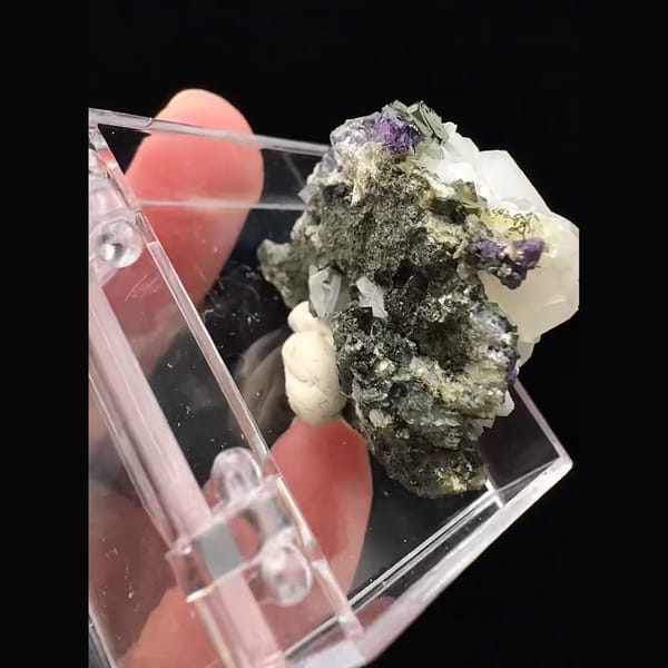 Small white blocky calcite with purple fluorite from Fujian — detail view
