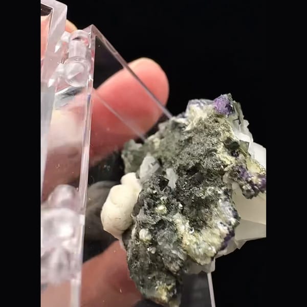 Small white blocky calcite with purple fluorite from Fujian — detail view