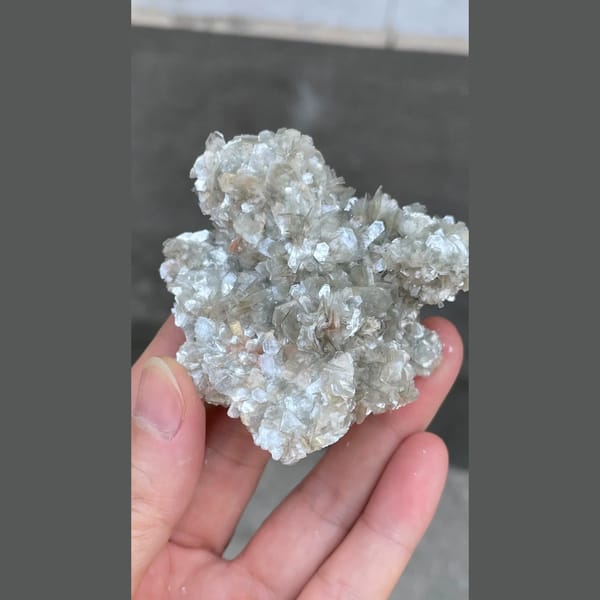 Glittering silvery mica flower cluster from Xuebaoding, Sichuan — alternate view